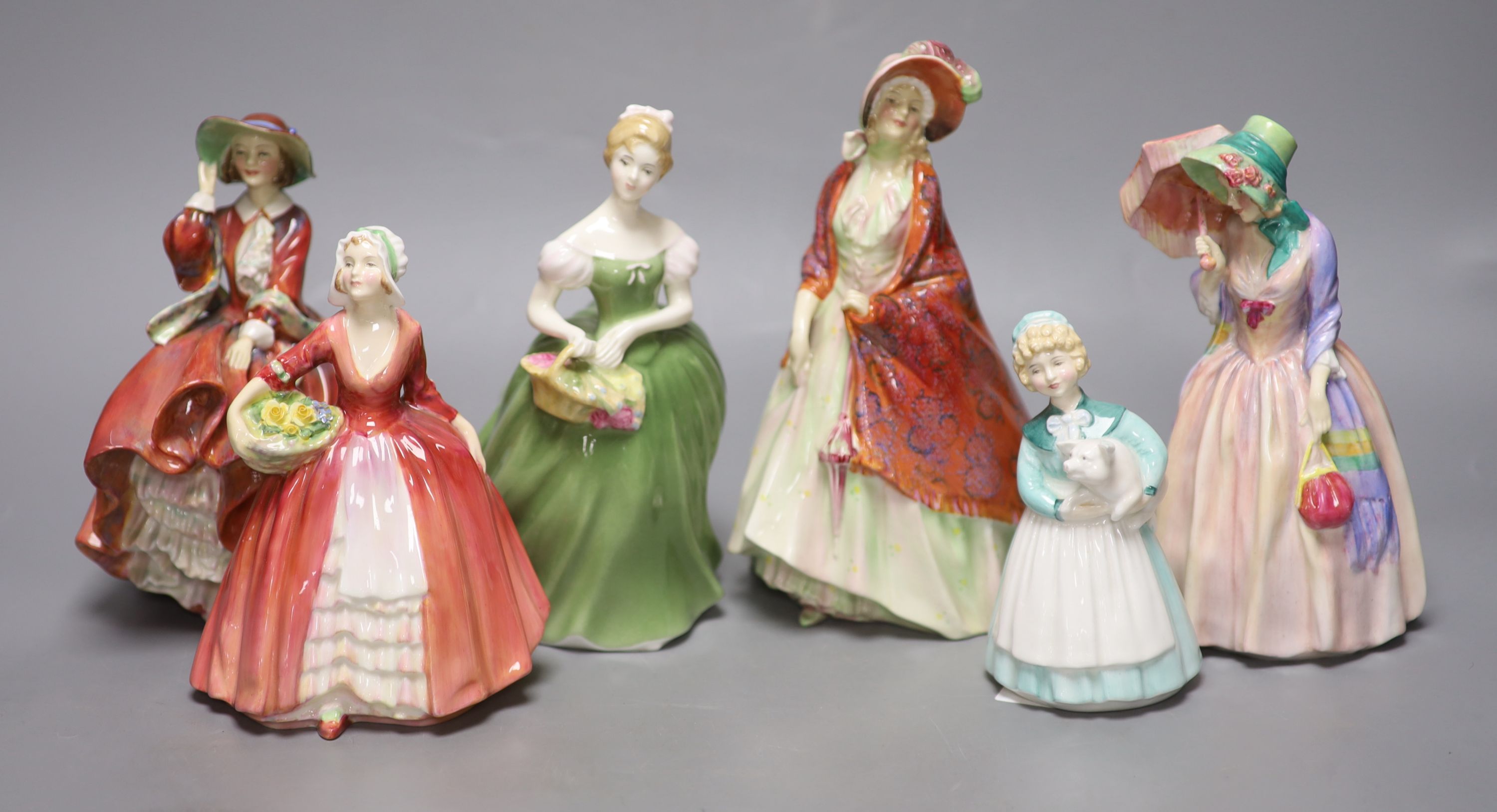 A collection of six Royal Doulton figures; The Paisley Shawl HN1392, Top o the hill HN1834, Clarissa HN2345, Stayed at home HN2207, Ja